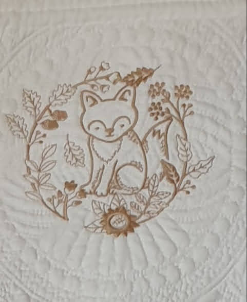 White embroidered quilt, enchanted animals