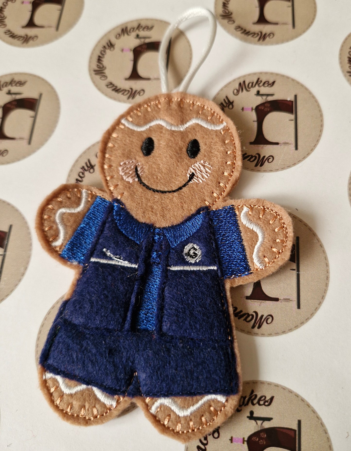 Shopworker blue uniform , gingerbread Christmas decoration